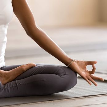  A restorative yoga class focused on relaxation, showcasing individuals in soothing poses, supported by props, with gentle stretches and deep breathing, creating a tranquil atmosphere, relieving tension, and fostering a sense of calm and rejuvenation.